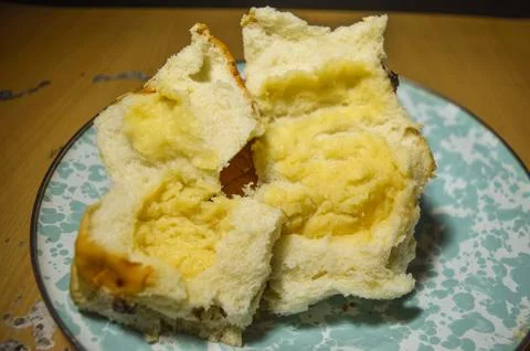 A tear bread shows cheese inside Stock Photos