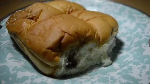 A tear bread shows chocolate inside food showcase Video stock 275637480