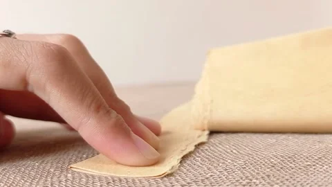 Tear up a brown paper for making a gift Stock Footage 146246308