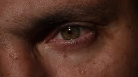 A tear flows from the man's eye, close-up Stock Footage 91144683