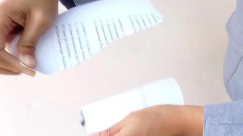 Tear off a paper into pieces Stock Footage 145562076