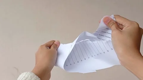 Tear off the paper into two pieces Stock Footage 151022869