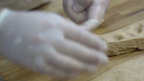 Tear off pieces of dough Stock Footage 69993652