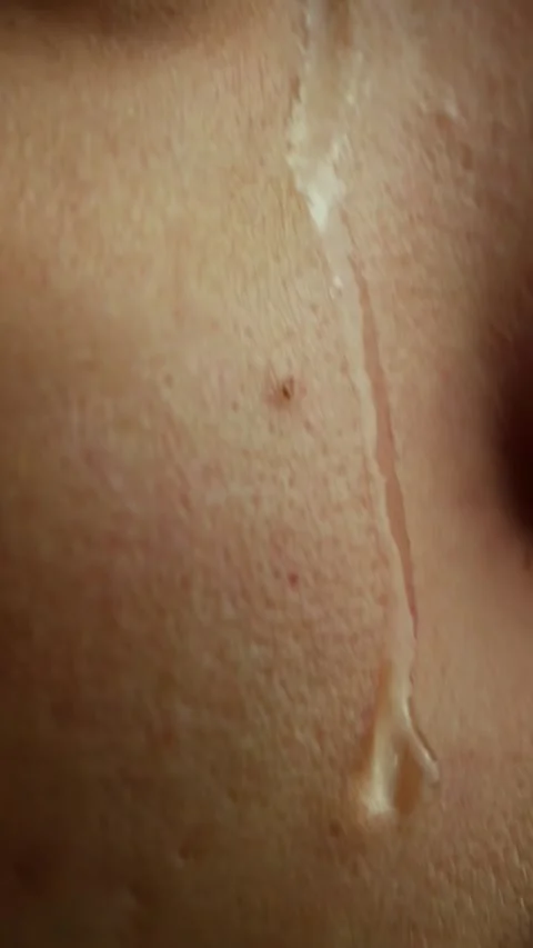 A Tear Running Down a Young Beautiful Woman Face, Macro Stock Footage 284110100