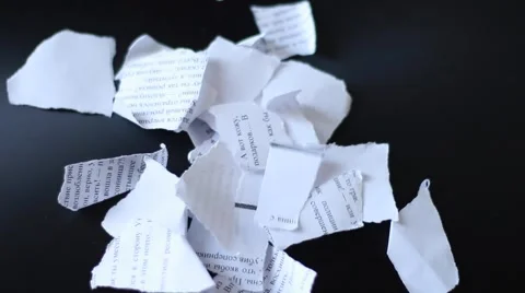 Teared pieces of paper on a table Stock Footage 65370741