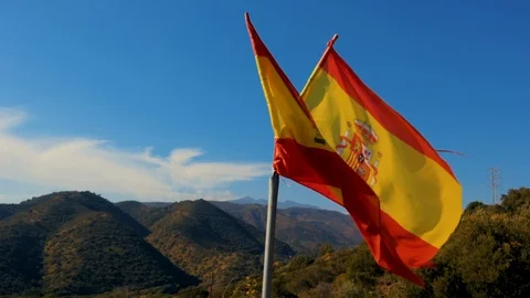 Teared up Spanish flag waving in slow motion Stock Footage 102774715