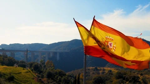 Teared up Spanish flag waving in slow motion Stock Footage 102774739
