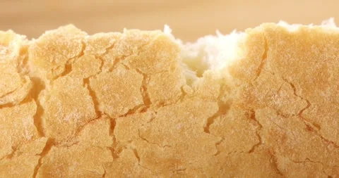 Tearing crust of fresh bread. Texture of bread close up. Stock Footage 242446156