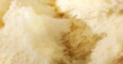 Tearing fresh bread. Texture of bread close up. Stock Photos