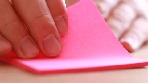 Tearing off sticking papers Stock Footage 86509022