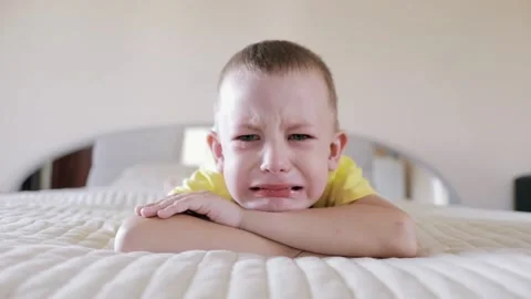 Tears. Portrait of a Crying Boy Lying on the Bed. Resentment, Annoyance. Stock Footage 156300938