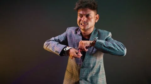 Teasing person imitates silly behavior when escaping cuff Stock Footage 313669320