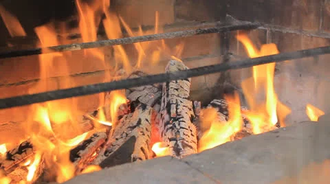 Teasing the wood in a brazier Stock Footage 24238180