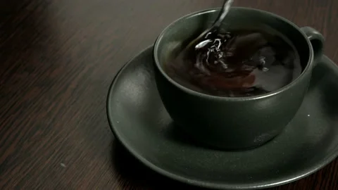 Teaspoon and cup of tea Stock Footage 204839643