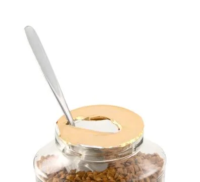 Teaspoon in a freshly opened jar of aromatic coffee Stock Photos