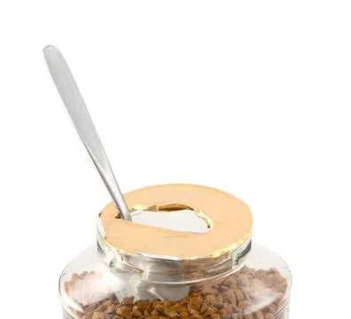 Teaspoon in a freshly opened jar of aromatic coffee Stock Photos