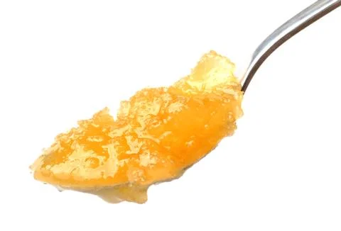 Teaspoon of honey isolated on white background. Stock Photos