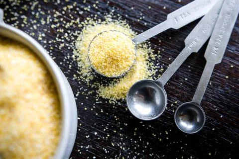 Teaspoon of polenta top-down Stock Photos
