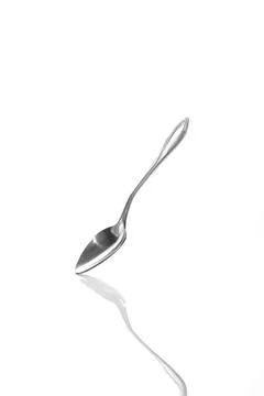 Teaspoon side view with mirror image isolated on white background Stock Photos