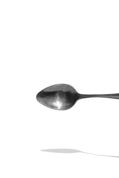 Teaspoon top view with reflection isolated on white background Stock Photos