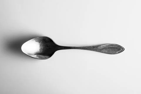 Teaspoon top view with reflection isolated on white background Stock Photos