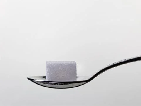 Teaspoon with white sugar Stock Photos