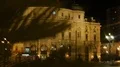 Teatro Arriaga opera house seen through palm tree, night life in Bilbao, Spain HD Footage