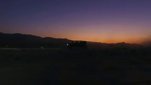 Tecate sunset driving an ATV car Stock Footage 121927268