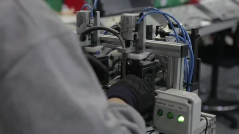 Tech assembly line over the shoulder slider shot Stock Footage 142736577
