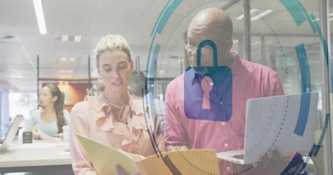 Tech colleagues opening folder and reviewing docs adding lock icon expanding Video stock 310850917