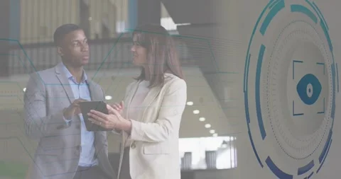 Tech colleagues tapping tablet and generating circuit lines and eye icon overlay Stock Footage 319800808