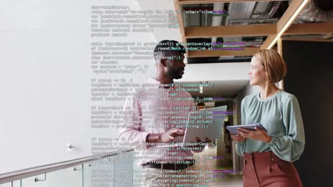 Tech colleagues viewing code on laptop and tablet, noise causing overlay Stock Footage 333132840