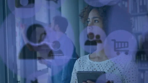 Tech coworker tapping tablet and adding notes for planning while icons+code Stock Footage 311224991