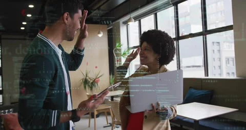 Tech coworkers using laptop tablet while woman pointing at code causing AR Stock Footage 318626454