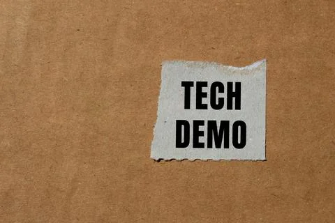 Tech Demo message written on ripped torn paper background. Conceptual Tech .. Stock Photos