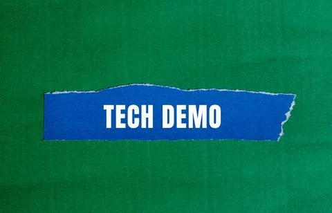 Tech Demo message written on ripped torn paper background. Conceptual Tech .. Stock Photos