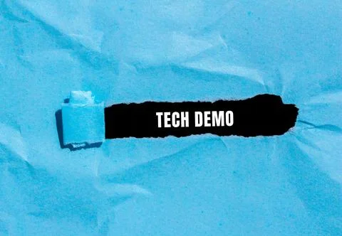 Tech Demo message written on ripped torn paper background. Conceptual Tech .. Stock Photos