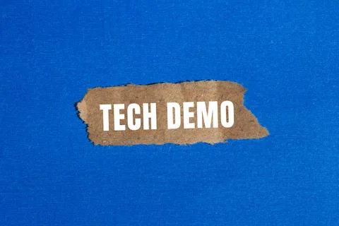 Tech Demo message written on ripped torn paper background. Conceptual Tech .. Stock Photos