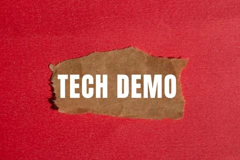 Tech Demo message written on ripped torn paper background. Conceptual Tech .. Stock Photos