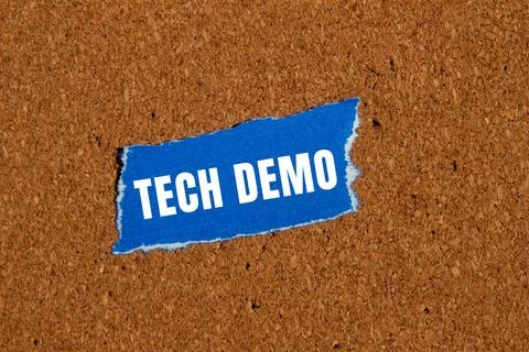 Tech Demo message written on ripped torn paper background. Conceptual Tech .. Stock Photos