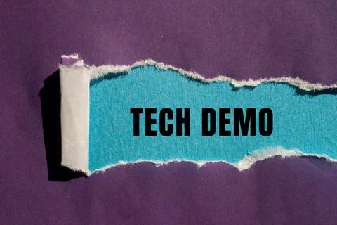 Tech Demo message written on ripped torn paper background. Conceptual Tech .. Stock Photos