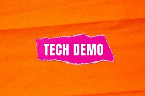 Tech Demo message written on ripped torn paper background. Conceptual Tech .. Stock Photos
