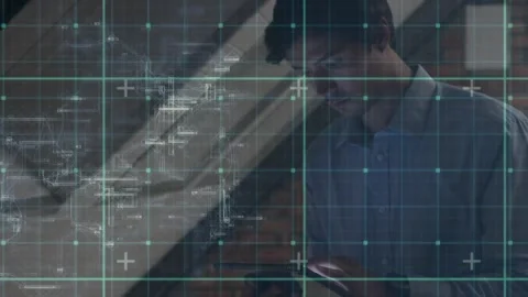 Tech designer bringing handheld tablet into view, tapping, analyzing specs with Stock Footage 321824122