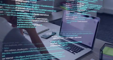Tech dev leaning forward, moving hand toward keys, causing code overlay to fill Stock Footage 330980591