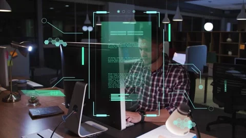 Tech developer reviewing monitor content, typing, holding phone while HUD Stock Footage 333774875