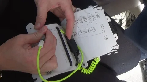 Tech diver copies runtime decompression chart to her slate Video stock 100956577