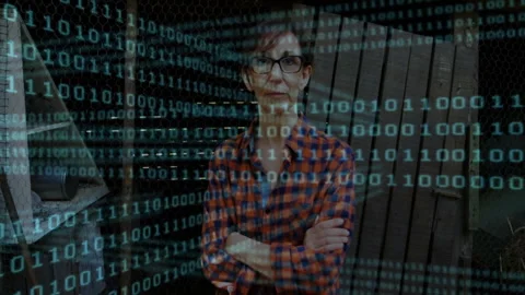 Tech engineer folding arms outdoors system initiating binary code drifting over Stock Footage 312695019