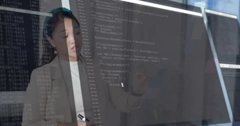 Tech engineer pointing at diagram on glass causing code overlay evolving Stock Footage 314868632