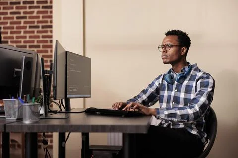 Tech enginner working on new user interface with online system Stock Photos