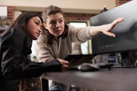 Tech enginners analyzing html code on computer Stock Photos